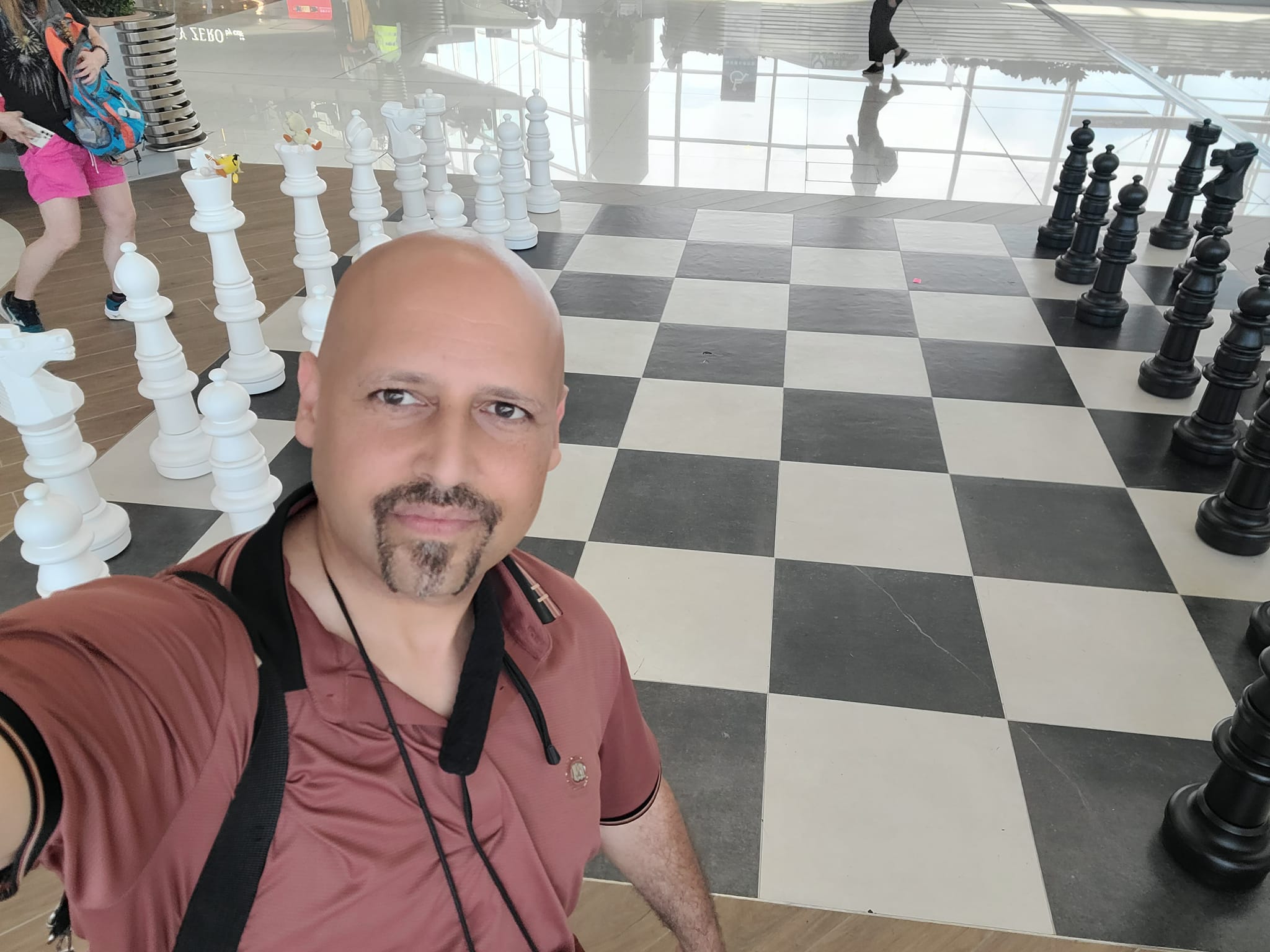 Playing on a Giant Chess Set at the Hong Kong Airport China on my way back home to Denver Colorado